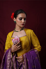 A mustard yellow anarkali gown