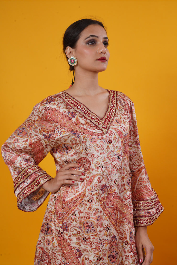 An ivory paisley print  suit set with handwork