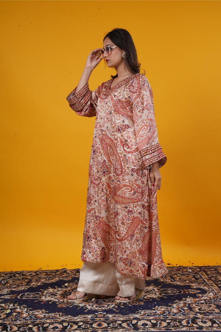 An ivory paisley print  suit set with handwork
