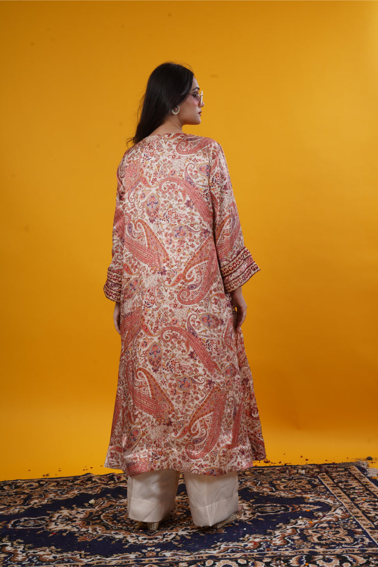 An ivory paisley print  suit set with handwork